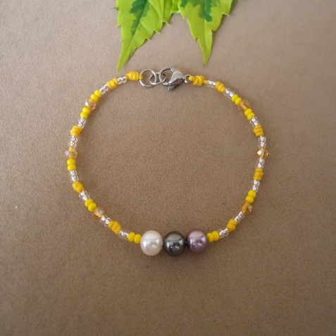 PULSERA EN PEDRERIA TONOS AMARILLOS CON PERLAS