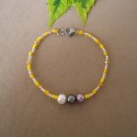 PULSERA EN PEDRERIA TONOS AMARILLOS CON PERLAS