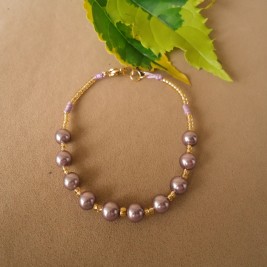 PULSERA EN PERLA MORADA